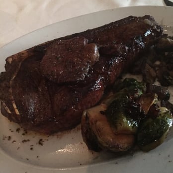 Steak 44 - Bone-in KC cut with foie gras on top. Portion of Brussels sprouts and mushrooms on the side as well - Steakhouses Near Me - Phoenix, Arizona Steak 44 - Bone-in KC cut with foie gras on top. Portion of Brussels sprouts and mushrooms on the side as well - Steakhouses Near Me - Phoenix, Arizona