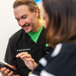 Dermacare Encinitas at Schoemann Plastic Surgery - Dr. Schoemann interacting with a patient, working one-on-one with patients to ensure their specific goals are met.