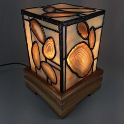 Jancik Glass - We have an exclusive line of stained glass and agate lamps made here in the studio. This is one of the lamps when it is turned on.