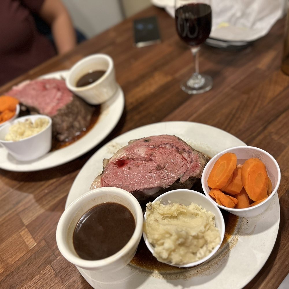 The Village Inn - a plate of meat, mashed potatoes, carrots, and gravy - Seafood Near Me - Dracut, Massachusetts