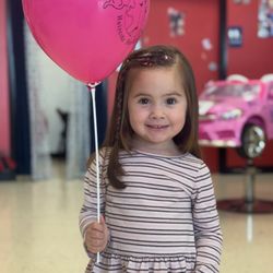Cookie Cutters Haircuts for Kids - Adorable smiles on this happy customer! Princess car, glitter, braids and a balloon!