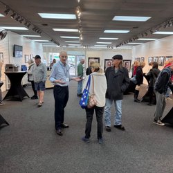 Ocean Art Gallery - Owner Frank Gromling speaking with show patrons.
