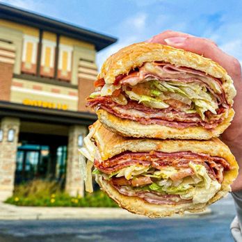 Potbelly - a hand holding a sandwich - Fast Food Near Me - Joliet, Illinois Potbelly - a hand holding a sandwich - Fast Food Near Me - Joliet, Illinois