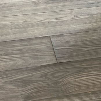 Empire Today - You can see the flooring lifting on the sides of the plank and at the butt joint. - Carpet Installation Near Me Empire Today - You can see the flooring lifting on the sides of the plank and at the butt joint. - Carpet Installation Near Me