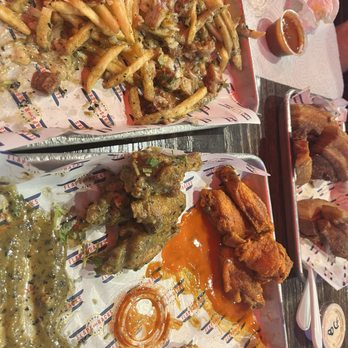 Flaps and Racks - Hot wings, green chili wings, pork belly fries with cilantro, onion and ranch this was just okay. The wings were good. - Chicken Wings Near Me - Tucson, Arizona Flaps and Racks - Hot wings, green chili wings, pork belly fries with cilantro, onion and ranch this was just okay. The wings were good. - Chicken Wings Near Me - Tucson, Arizona