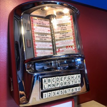 Wilson's Ice Cream Parlor - Juke box on the table - Ice Cream & Frozen Yogurt Near Me - Ephraim, Wisconsin Wilson's Ice Cream Parlor - Juke box on the table - Ice Cream & Frozen Yogurt Near Me - Ephraim, Wisconsin