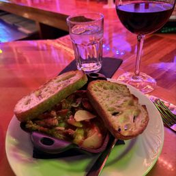 Gambas con chorizo - shrimp and chorizo on a white wine sauce topped by toasted bread.