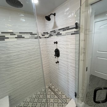 Building Creations - This bathroom upgrade features beautiful tile walls, tiled shower pan, and stunning glass door. - General Contractors Near Me - Crofton, Maryland Building Creations - This bathroom upgrade features beautiful tile walls, tiled shower pan, and stunning glass door. - General Contractors Near Me - Crofton, Maryland