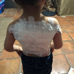 DermBar- Bonita Springs - When I got home, we used non-stick gauze and LOTS of tape to keep it secure.
