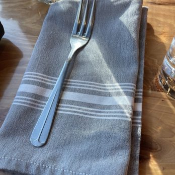 Grinning Mule Saloon and Kitchen - Table setting with 3 prong fork - Bars Near Me - Charlotte, North Carolina