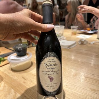Williams-Sonoma - a hand holding a bottle of wine - Specialty Food Near Me - Mission Viejo, California Williams-Sonoma - a hand holding a bottle of wine - Specialty Food Near Me - Mission Viejo, California