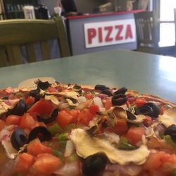 Pizza Rolla - We eat a plant based diet so our pizza was a veggie pizza, no cheese, add tobasco hot sauce