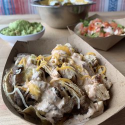 Casa Del Bro - We got a grilled chicken taco & a ribeye end caps taco drizzled with chipotle sour cream, cheese and pineapple habanero sauce.