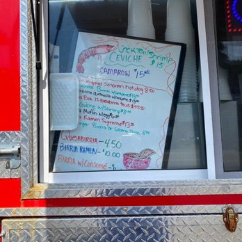Taqueria Los Compas - a menu in the window - Food Trucks Near Me - Astoria, Oregon