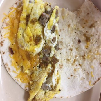 Magoo's Place - Sausage & egg taco with unwanted cheese - Burgers Near Me - Alpine, Texas Magoo's Place - Sausage & egg taco with unwanted cheese - Burgers Near Me - Alpine, Texas