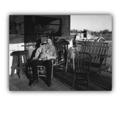 Herb's Limestone Country Club - Herb in the sun room. His collection of fire trucks behind.