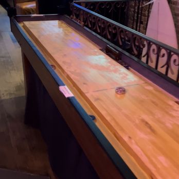 The Upstairs at 66 - a shuffle table in a bar - Lounges Near Me - New York, New York The Upstairs at 66 - a shuffle table in a bar - Lounges Near Me - New York, New York