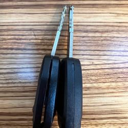 Costco Tire Center - Bent key on the left with cracked plastic housing. Repaired key on the right.