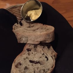 Olive and rosemary bread with butter. Comes out warm and fresh. You can have as much as you want. Free refills on the bread.
