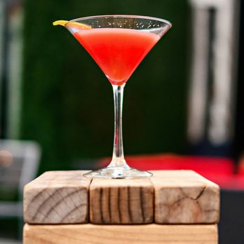Virtue Rooftop - a red cocktail sitting on a stack of wooden blocks - Lounges Near Me - Atlanta, Georgia Virtue Rooftop - a red cocktail sitting on a stack of wooden blocks - Lounges Near Me - Atlanta, Georgia