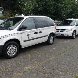 Abby Cabby - All of our taxis are white with black lettering.