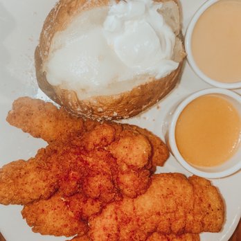 Outback Steakhouse - Chicken Tenders with Honey Mustard sauce and a Baked Potato with both butter and sour cream. - Steakhouses Near Me - Indianapolis, Indiana Outback Steakhouse - Chicken Tenders with Honey Mustard sauce and a Baked Potato with both butter and sour cream. - Steakhouses Near Me - Indianapolis, Indiana