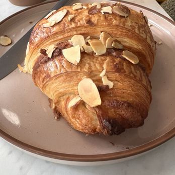 The Bees Knees Bistro - Almond croissant (the half that's was still there by the time I took the picture). - Cafes Near Me - Wallingford, Connecticut The Bees Knees Bistro - Almond croissant (the half that's was still there by the time I took the picture). - Cafes Near Me - Wallingford, Connecticut