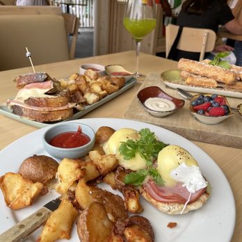 Madi - Waffle churro sticks, Ham Benny, Orange Pineappy Kale, Cortado, and the Monte Cristo Sammy - Breakfast & Brunch Near Me - San Diego, California Madi - Waffle churro sticks, Ham Benny, Orange Pineappy Kale, Cortado, and the Monte Cristo Sammy - Breakfast & Brunch Near Me - San Diego, California