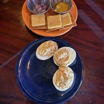 Revel Cafe and Bar - Buffalo deviled eggs and cheese and crackers - Cocktail Bars Near Me - New Orleans, Louisiana Revel Cafe and Bar - Buffalo deviled eggs and cheese and crackers - Cocktail Bars Near Me - New Orleans, Louisiana