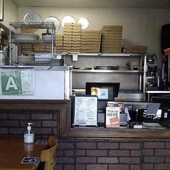 Raffallo's Pizza - Ordering counter, pizza boxes in the back and their clean kitchen. - Pizza Near Me - Los Angeles, California Raffallo's Pizza - Ordering counter, pizza boxes in the back and their clean kitchen. - Pizza Near Me - Los Angeles, California