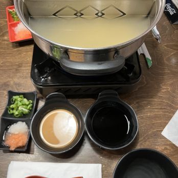 Ichiriki - Ginger Salt Broth, sauces, mix ins - green onion, plain daikon or with a bit of heat (orange colored). - Japanese Near Me - Honolulu, Hawaii