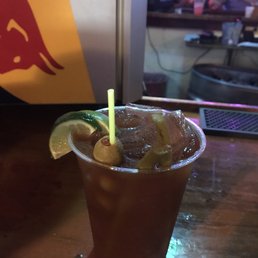a cold drink with a lime garnish a cold drink with a lime garnish