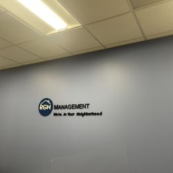 RGN Management - Office wall with logo