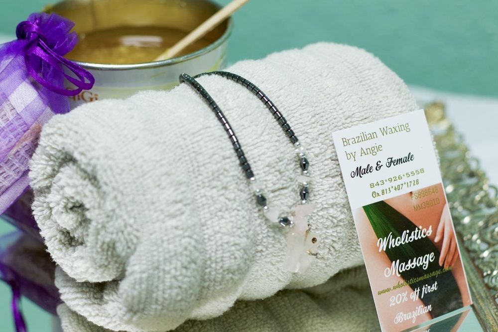 Wholistics Massage Logo