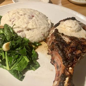 Carrabba's Italian Grill - Pork chop with sweet bourbon butter, side of garlic sautéed spinach and garlic mashed potatoes - Italian Near Me - Greenbrook, New Jersey Carrabba's Italian Grill - Pork chop with sweet bourbon butter, side of garlic sautéed spinach and garlic mashed potatoes - Italian Near Me - Greenbrook, New Jersey