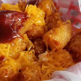 The Blue Gator - Cheddar tator tots, added a side of BBQ sauce. - Seafood Near Me - Dunnellon, Florida The Blue Gator - Cheddar tator tots, added a side of BBQ sauce. - Seafood Near Me - Dunnellon, Florida