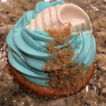 Devon's Delish Delights - a cupcake with blue frosting - Desserts Near Me Devon's Delish Delights - a cupcake with blue frosting - Desserts Near Me