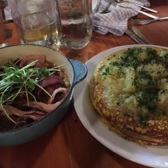 Cabane à Sucre Au Pied de Cochon - Egg soufflé with cheddar sauce and potatoes. Bacon on top off pea soup - Canadian (New) Near Me - Mirabel, Quebec Cabane à Sucre Au Pied de Cochon - Egg soufflé with cheddar sauce and potatoes. Bacon on top off pea soup - Canadian (New) Near Me - Mirabel, Quebec