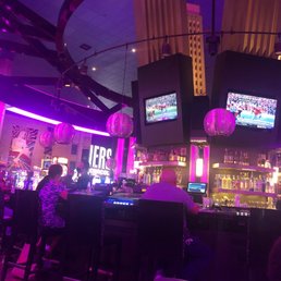 The bartender talking to the couple,the white gentleman sitting down...
