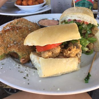 Ricos World Kitchen - Oyster po boy with fried green tomatoes - New American Near Me - Buford, Georgia Ricos World Kitchen - Oyster po boy with fried green tomatoes - New American Near Me - Buford, Georgia