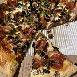 Pizza Hut - Definitely not thin and crispy , not many veggies , crust looks old