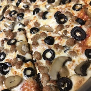 Pizza Plus of White Pine - a pizza with black olives and sausage - Pizza Near Me - White Pine, Tennessee Pizza Plus of White Pine - a pizza with black olives and sausage - Pizza Near Me - White Pine, Tennessee