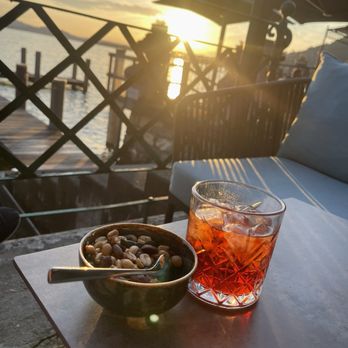 Hotel Vitznauerhof - Negroni and complimentary nuts . Great lakeside view by hotel dining area - Hotels Near Me - Vitznau, LU