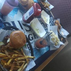 Eagle's Nest Resort - Bacon cheeseburger with fries. Side of onion rings. Bloody Mary, chicken tenders with potato chips.