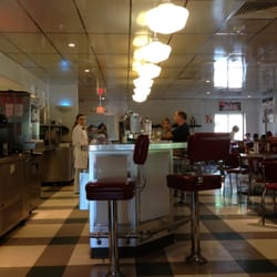 Johnny rockets sitting at booth looking at bar