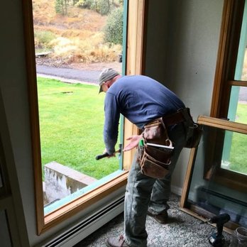 Inside Out Handyman - a man working on a window - Handyman Near Me - Missoula, Montana