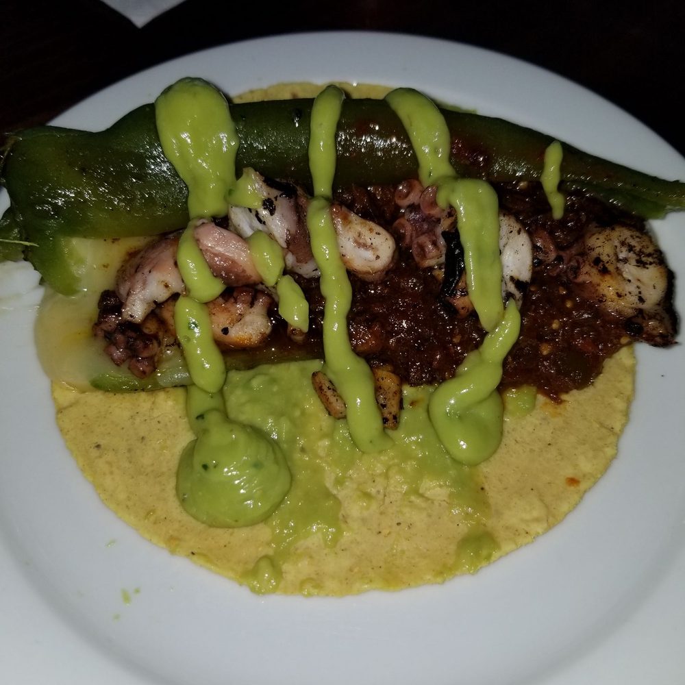 La Corriente Cevichería Nais - Taco Cachanilla- Octopus and Beef Shank with Anaheim Chile in Mole sauce with guacamole on top - Seafood Near Me - Mexicali, BCN La Corriente Cevichería Nais - Taco Cachanilla- Octopus and Beef Shank with Anaheim Chile in Mole sauce with guacamole on top - Seafood Near Me - Mexicali, BCN