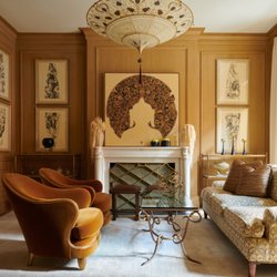 Scarsdale Framing - Livingroom with framed art on the walls by Scarsdale Art and Frame