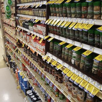 Tom Thumb - a grocery store aisle with shelves of food - Grocery Near Me - Duncanville, Texas