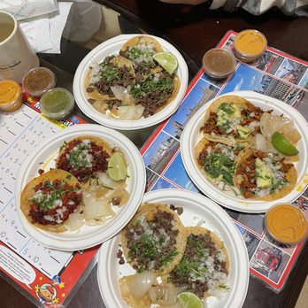 Tacos Chencho - three plates of tacos on a table - Food Trucks Near Me - San Jose, California Tacos Chencho - three plates of tacos on a table - Food Trucks Near Me - San Jose, California